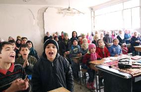 Children in war-ravaged Aleppo