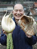 Farmer happy with his glove-shaped radish