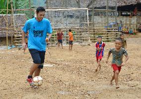 Japan ex-pro footballer plays with kids at Myanmar refugee camp
