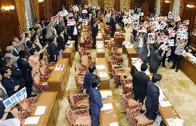 Japan ruling camp rams security bills through Diet panel