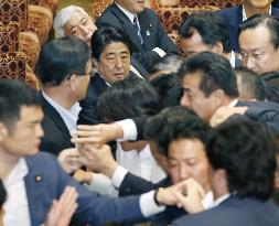 Controversial Japan security bills clear upper house panel