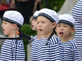 Children sing in chorus at WWII event marking Russian victory