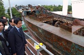 Abe inspects N. Korean spy ship on display