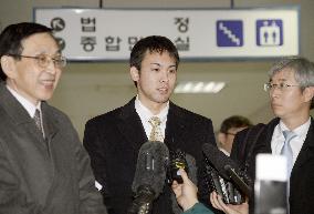 Japan swimmer speaks to reporters after court appearance in Incheon