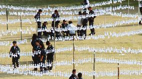 More than 11,700 talisman cloth dolls hung for Guinness record