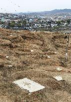 N. Korea opens Japanese burial site to Kyodo News
