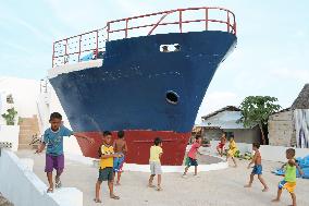 Part of washed-up ship becomes typhoon monument in Philippines