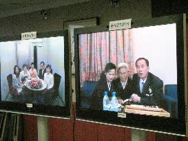 North, South Koreans arrange reunion on television screens