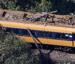 Train hits leaning utility pole in central Japan