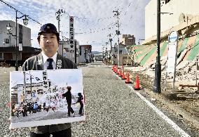 Fukushima man shows photo of defunct 'Naked Pilgrimage' procession