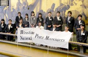 Japan high schoolers hold peace banner at Geneva disarmament talks