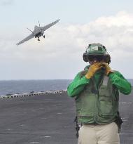 Fighter jet flies off from U.S. flattop in naval drill