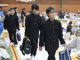 Students head to school from shelter