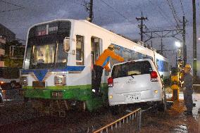 Car, train crash in Japan, but no injuries reported