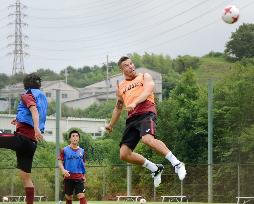 Soccer: Podolski joins first training session in Kobe