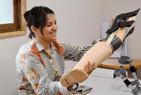 Afghan woman given new artificial leg to "walk to her dream"