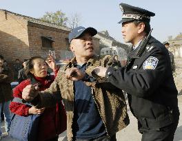 Last man resisting eviction for Beijing Olympics removed