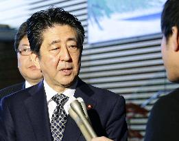 Abe looks for best outcome in ruling bloc's tax talks