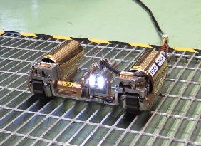 Remote-controlled robot to probe crippled Fukushima reactor vessel