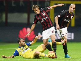 Japanese MF Honda of Milan competes for ball in Chievo match