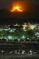Giant bonfire lights up Kyoto mountain