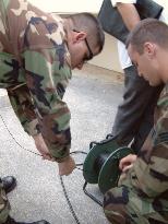 (2)Police, U.S. Air Force begin defusing sergeant's rockets