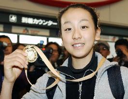 Figure skater Asada returns to Japan