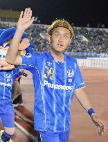 Gamba's Usami waves to fans after winning game in ACL