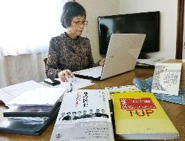 Member of translators' group works for peace in Kobe