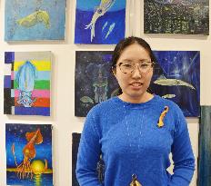Woman painter specializes in drawing squid
