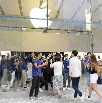 Apple's new iPhones go on sale in Japan