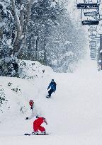 Snowborders enjoy 1st run on natural snow on Mt. Kurodake