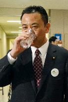 State minister drinks purified Fukushima water to show safety