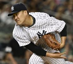 Tanaka wins 6th game with 7 solid innings