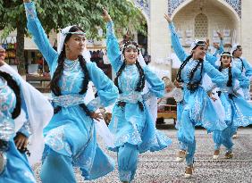Uzbek women dance in ancient city Bukhara, World Heritage site