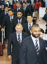 Japan rugby team returns home