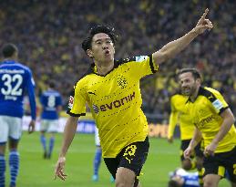 Kagawa on target as Dortmund win derby thriller