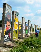Dictators drawn on Berlin Wall pieces