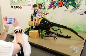 Children ride giant mock beetle at Tokyo Skytree Town