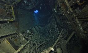 Bed fragments litter living quarters of sunken U.S. warship