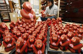 Craftsman busy in creating monkey dolls