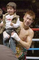 Japan's Hasegawa retains WBC title with TKO win
