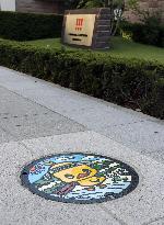 Ramen mascot depicted on manhole cover