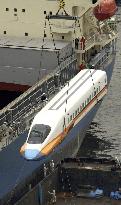 Bullet train cars loaded onto freighter heading to Taiwan