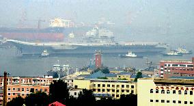 China's 1st aircraft carrier returns to port