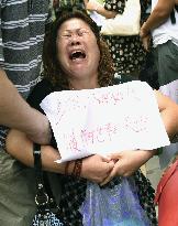 Kin of Chinese passengers on missing Malaysian plane protest