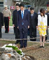 Abe pays respects at military graves ahead of Pearl Harbor visit