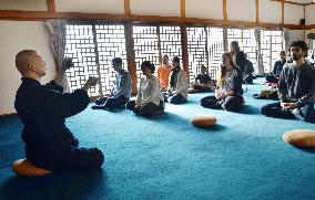 Foreigners experience Buddhist monk life at Mt. Koya heritage site