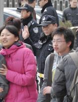 Chinese police disperse street protesters