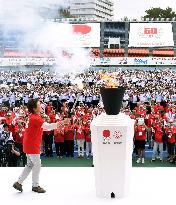 1964 Olympic medalist lights cauldron at anniversary event